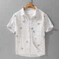 Men's light green pure cotton loose short sleeve shirt with a printed letter design on the chest.