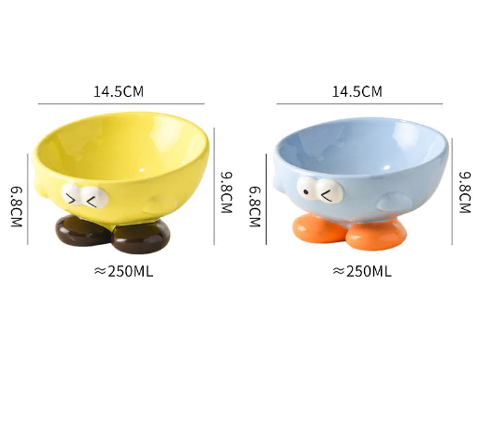 Ceramic slanted pet bowl with cute expression design in blue, yellow, and set colours for cervical spine support.