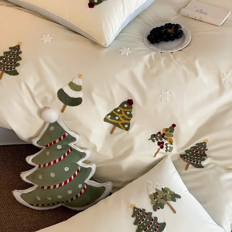 Pure cotton duvet cover and pillowcase set with raised embroidered Christmas tree and floral design in green and cream.