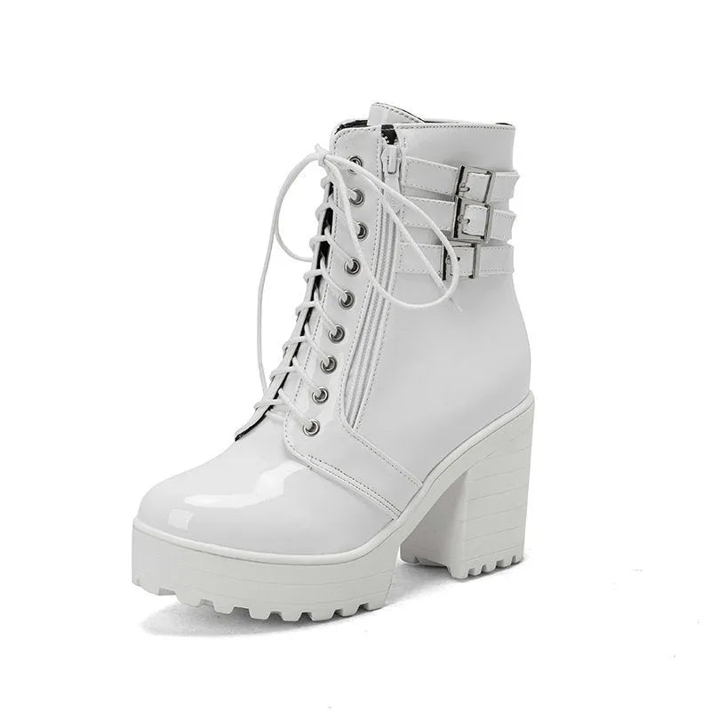 Women's black thick-heeled ankle boots with a lace-up front and waterproof platform on a rubber sole.