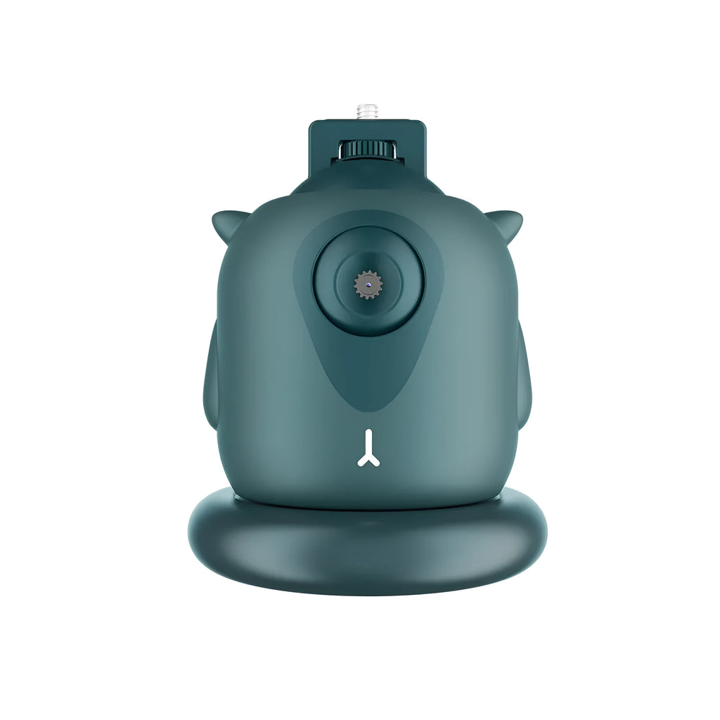 Dark green intelligent AI face tracking gimbal with 360-degree rotation on a desk.