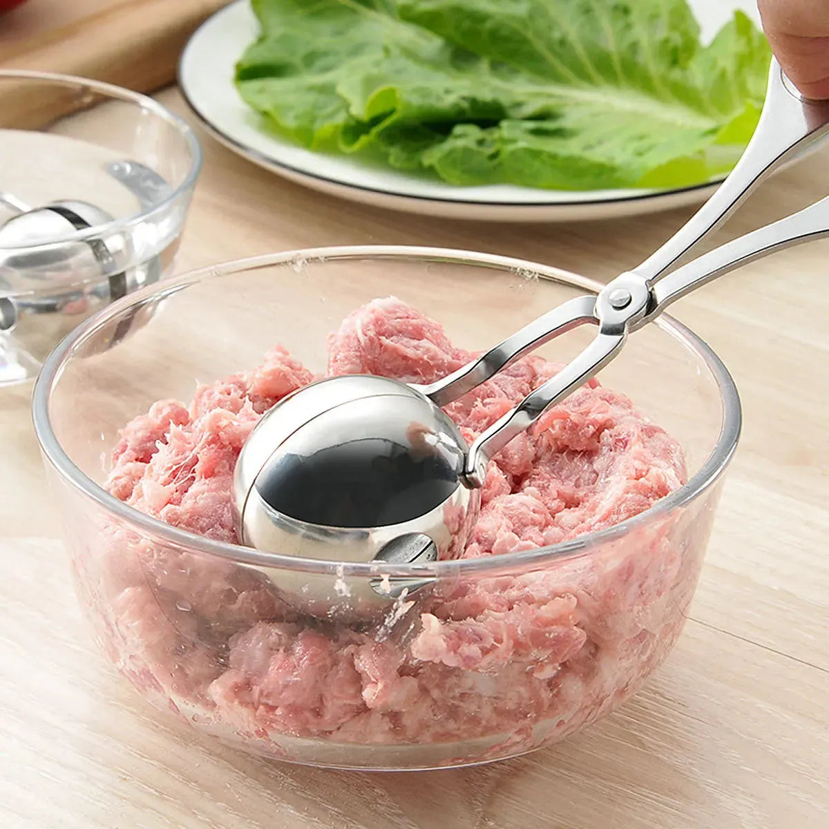 Stainless steel meatball maker tool clip with water-polished finish forming a uniform ball