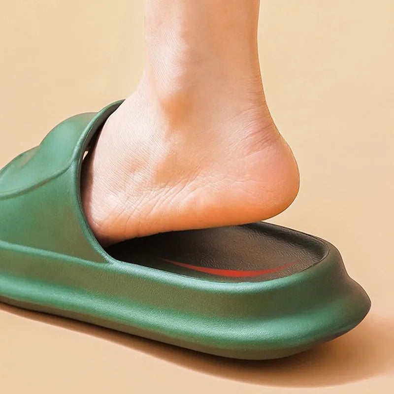 Soft EVA slippers with thick non-slip sole in various colours on a bathroom floor.