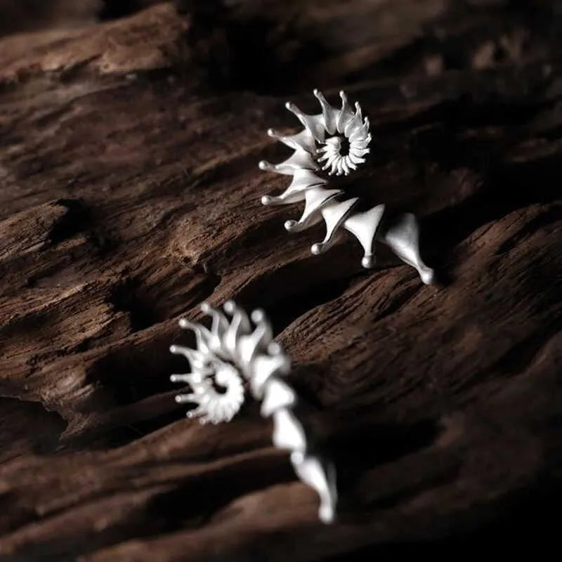 Conch-shaped three-dimensional matte earrings with exaggerated drop design and irregular shaping