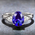 Women's sterling silver court ring with natural blue zircon stone in a heart-shaped inlay.