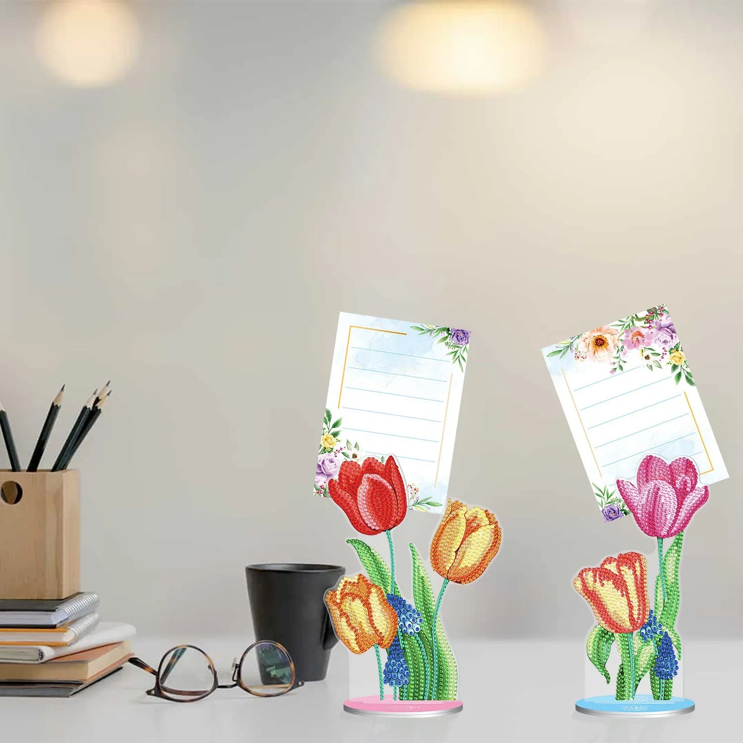 Handmade diamond painting decorative note clip on a desk holding a memo.