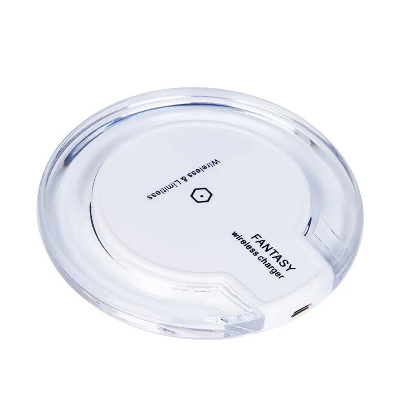 Round 15W magnetic wireless charger disc in white, black, and transparent finishes on a desk