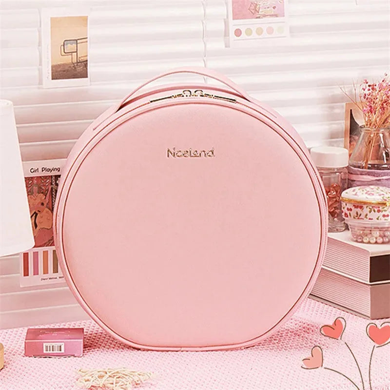 Round cherry blossom pink PU leather makeup bag with built-in LED mirror and internal partitions.