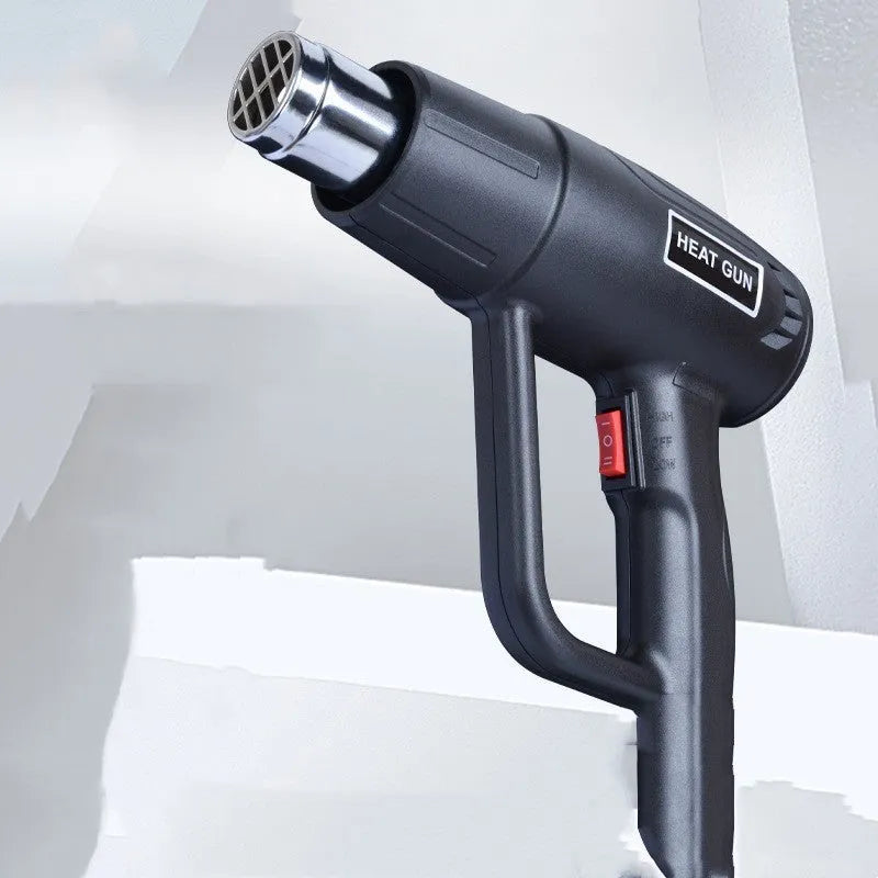 A black 2000W hot air gun with a two-speed switch and grid-pattern air outlet.