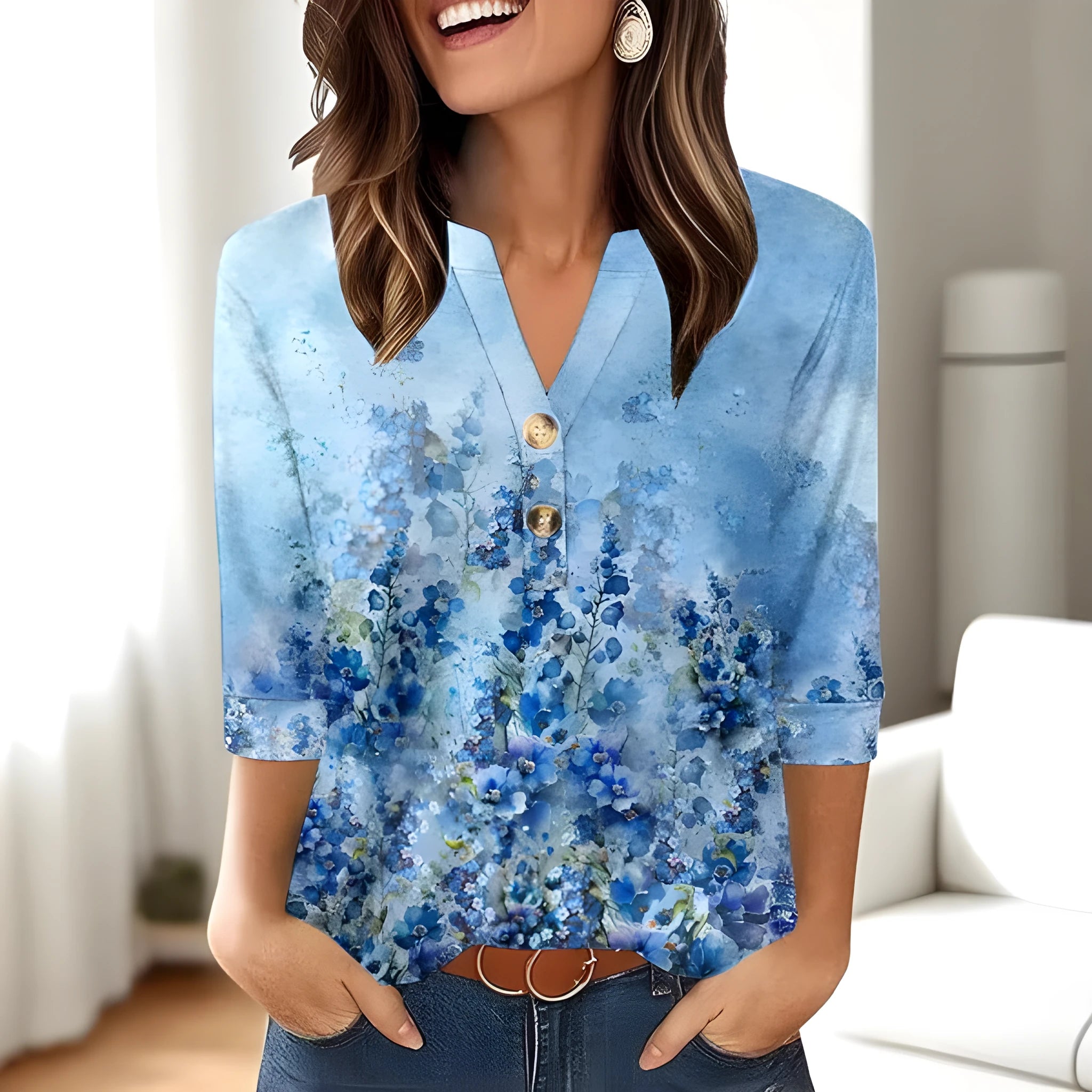 Women's loose-fit grey V-neck top with a white 3D geometric pattern print on the front.