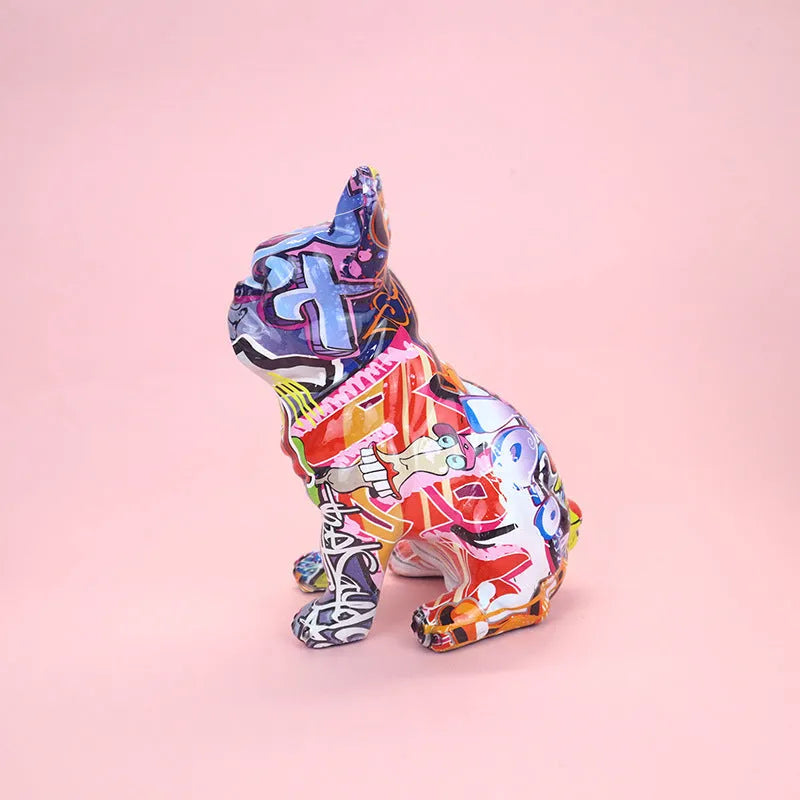 Graffiti-coloured French Bulldog resin statue on display surface