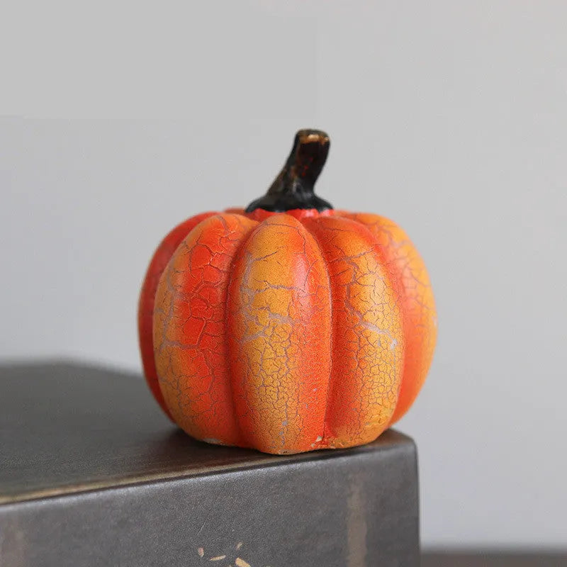 Three LED pumpkin lanterns in different sizes with realistic surface cracks and candle-like glow