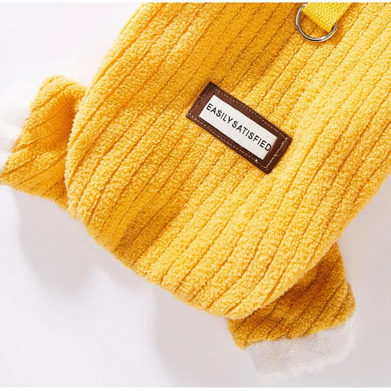Yellow ribbed fleece pet jumpsuit with white ruffled cuffs and leash ring for cats and small dogs.