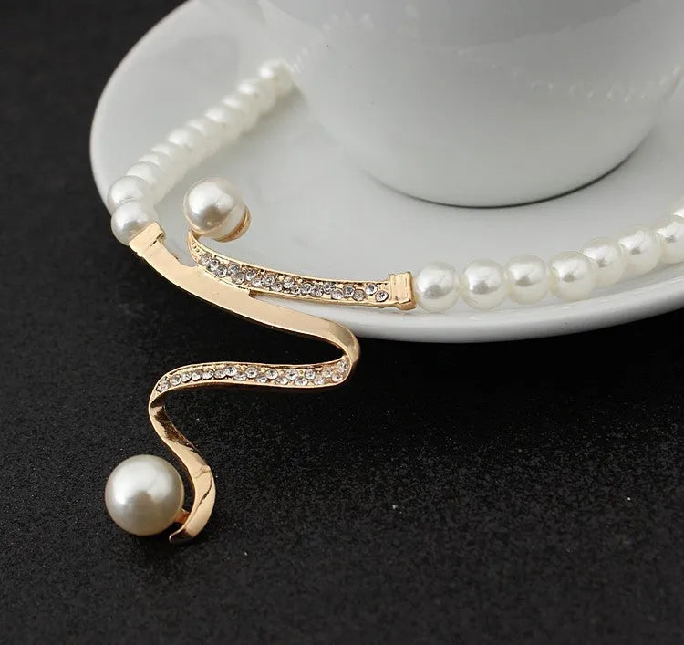 Gold electroplated pearl necklace and earrings set with deep V clavicle design
