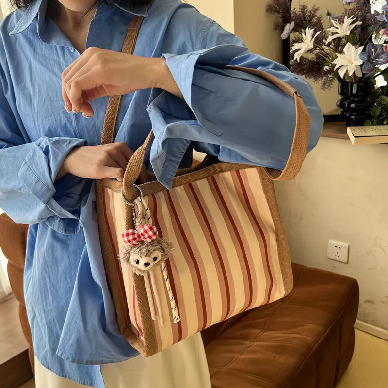 Women's large-capacity urban simplicity tote bag in blue, green, khaki, and pink with internal phone pocket and double shoulder straps