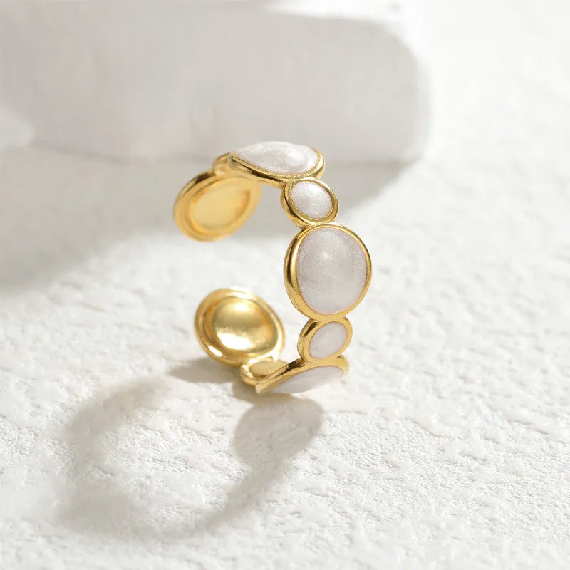 A geometric-shaped stainless steel ring with an adjustable opening and a shiny electroplated finish.