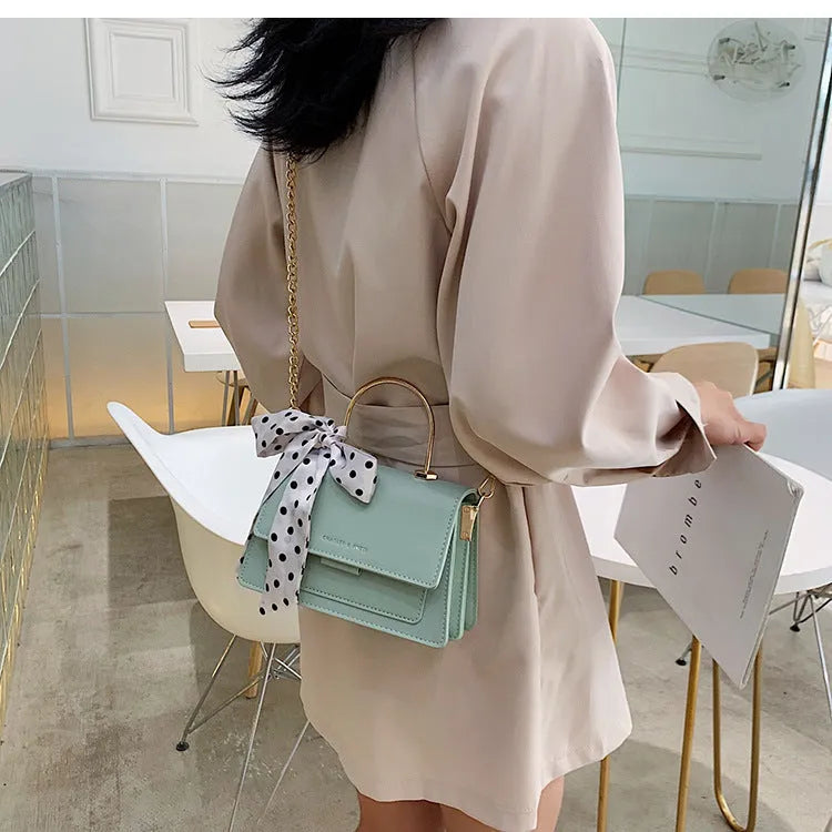 Small PU messenger bag for women, chain shoulder strap, lock closure, available in five colours