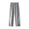 Men's straight-leg casual trousers in black, showing loose fit and button fly detail.