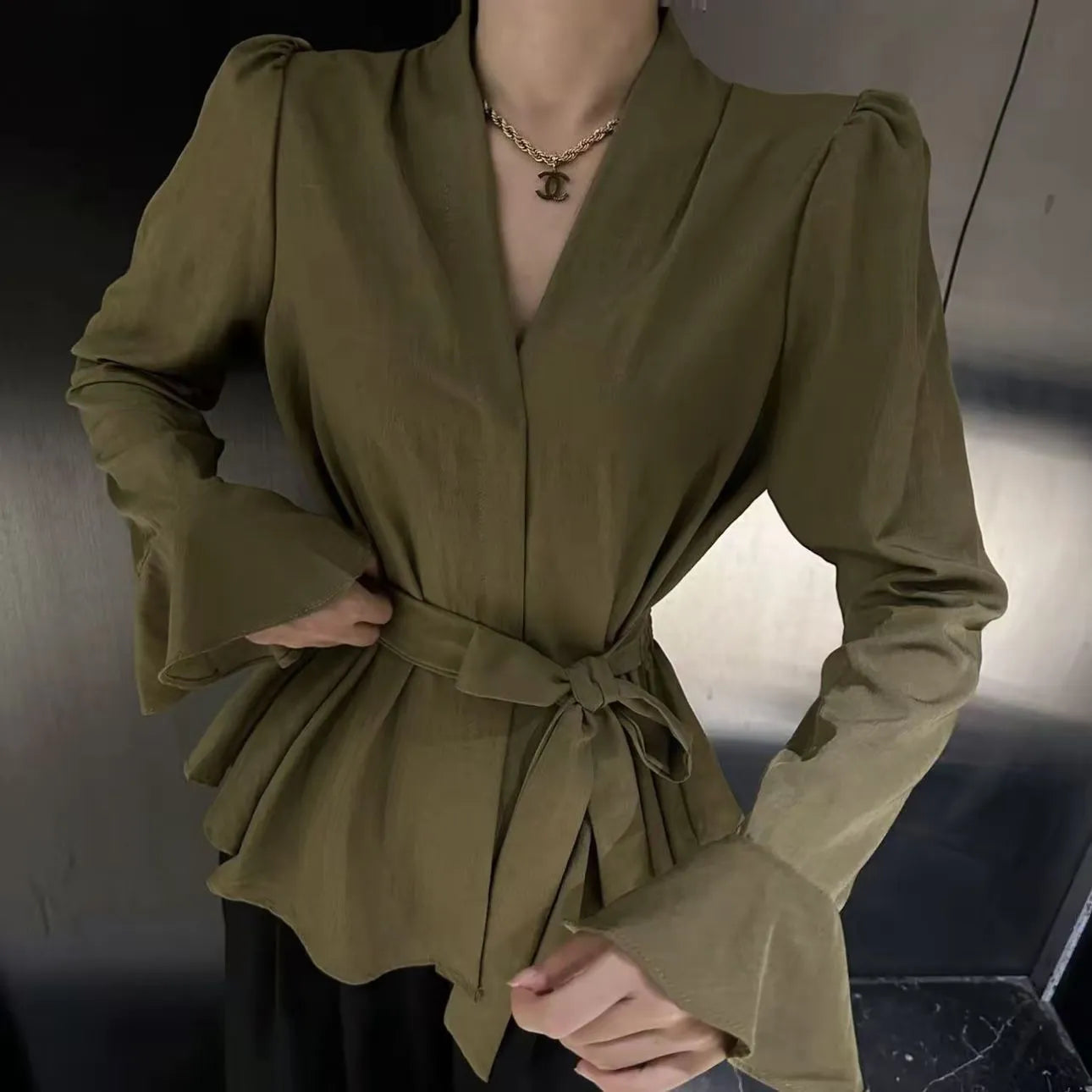 Women's black French-style shirt with an irregular collar and flared bell sleeves