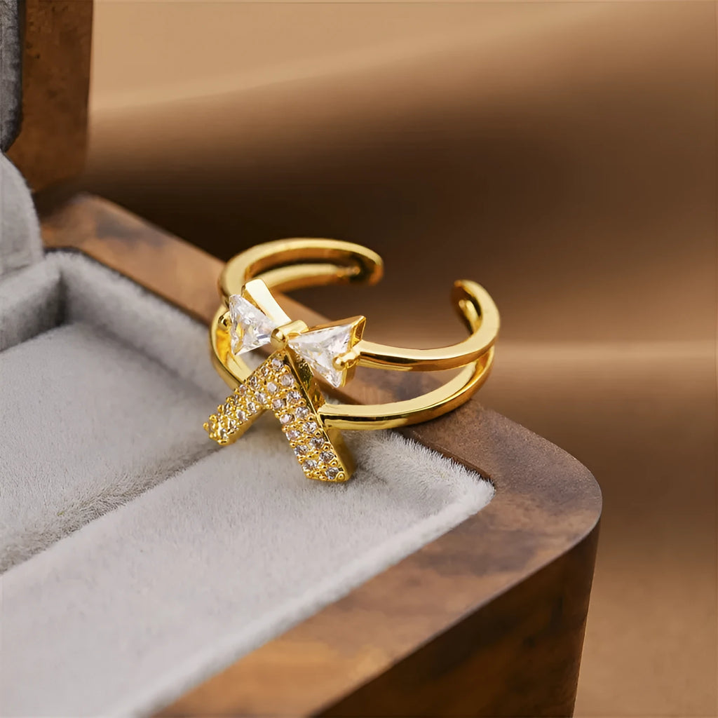Gold geometric open band adjustable ring on a hand, showing its copper construction and modern design.