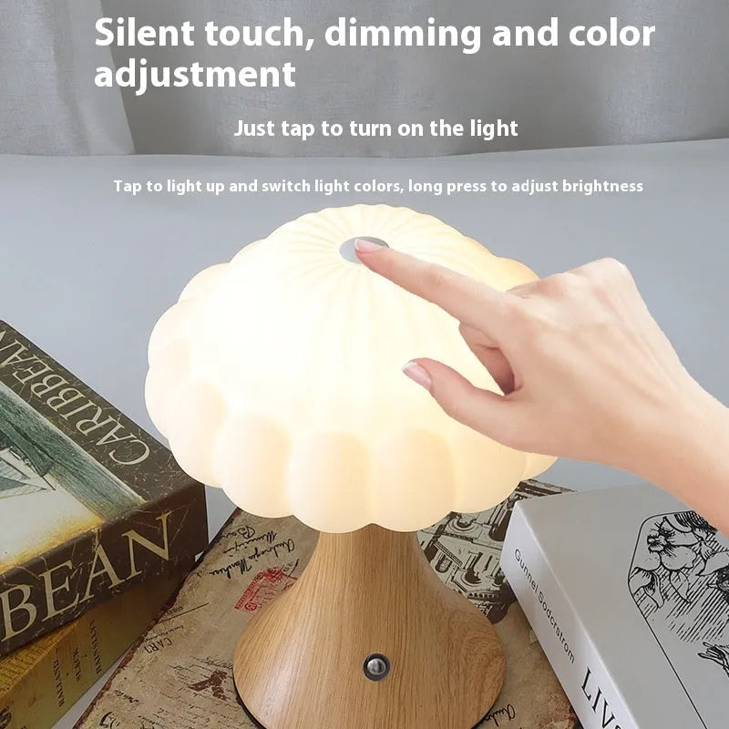 Decorative mushroom-shaped touch lamp in wood grain colour on a tabletop.