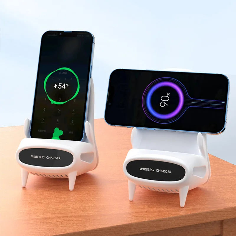 White mini chair shaped wireless charging stand holding a mobile phone on a desk.