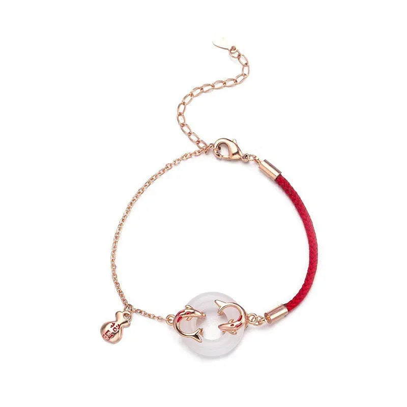 Women's festive koi bracelet with mixed materials, fishtail elements, and peace buckle closure