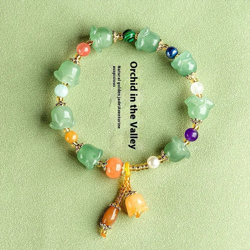 Natural Xinjiang Jinsi Jade bracelet with carved orchid beads in aventurine orchid colour.