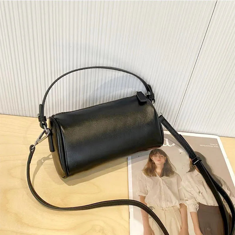 Genuine leather mobile phone crossbody bag with cylindrical design in six colour options showing sewing thread detailing