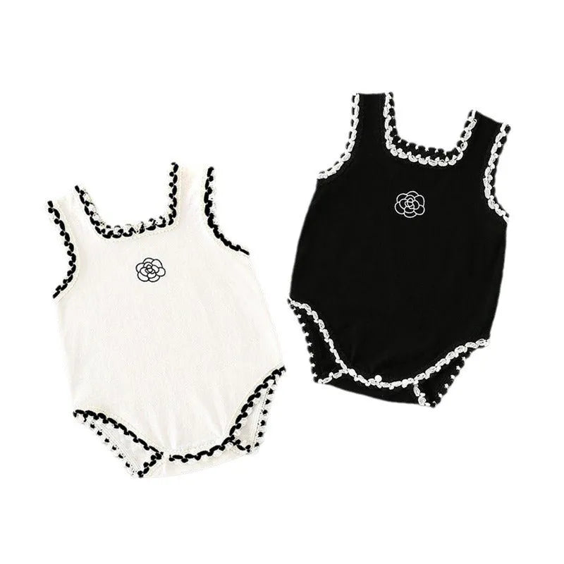 Baby triangle rompers made of cotton, sleeveless with lace accent, available in white and black, sizes for heights 59-90cm.