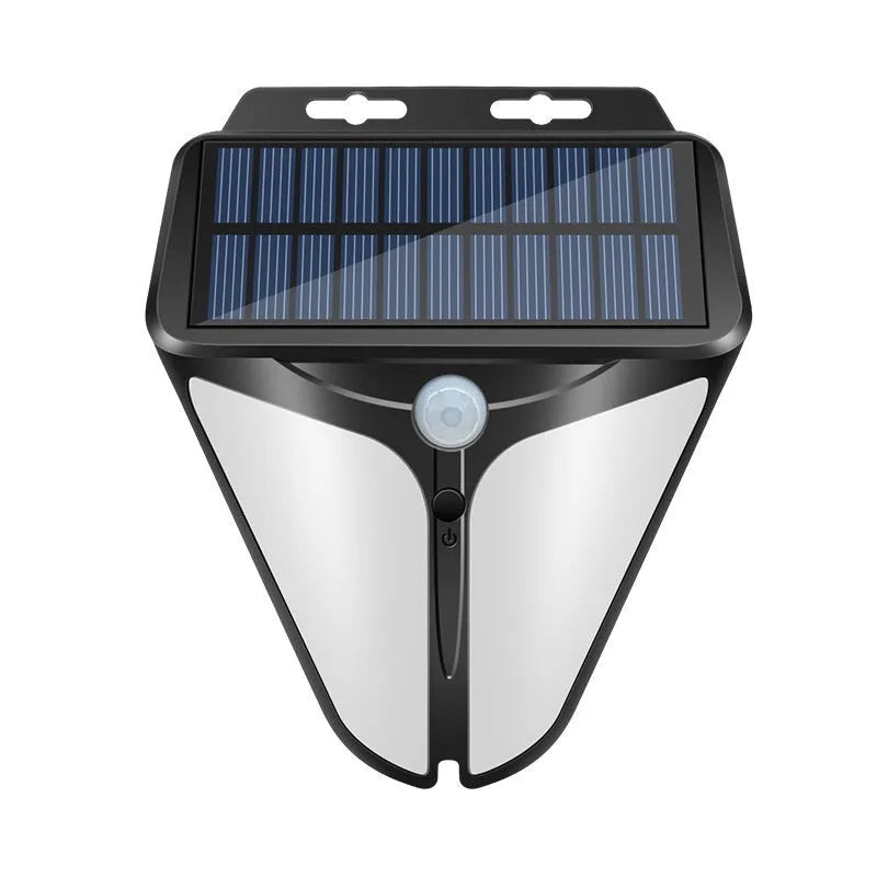 Heart shaped human induction solar wall lamp with binocular lights on an exterior wall in a villa courtyard