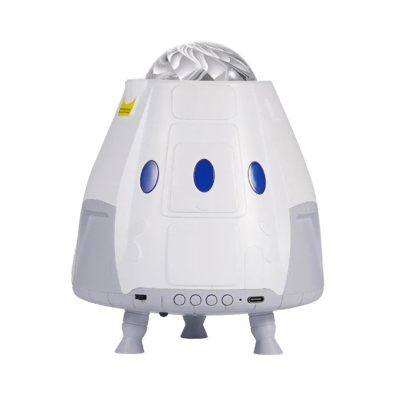 Compact white cube-shaped USB galaxy projection lamp with remote control on a table
