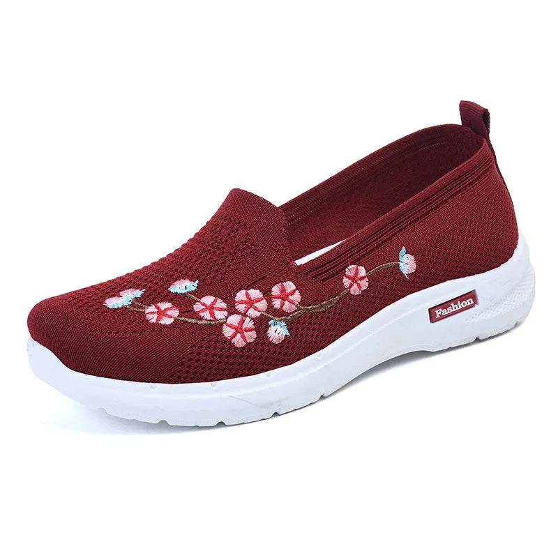 Women's woven floral embroidery casual pumps with a low heel and round toe in wine red colour.