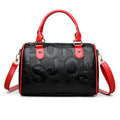 Brown cylindrical crossbody bag with three adjustable shoulder straps showing leather-like PU material texture