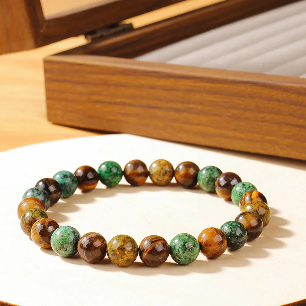 Tigereye natural stone fortune bracelet showing antique floral design and handmade construction