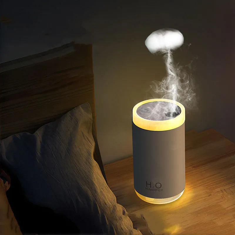 Jellyfish-shaped USB humidifier with smoke ring mist output and warm night light in blue colour