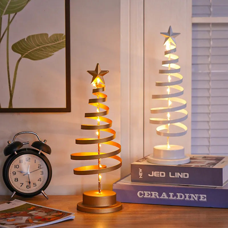 33cm wrought iron Christmas tree spiral light ornament with warm white LED illumination on table