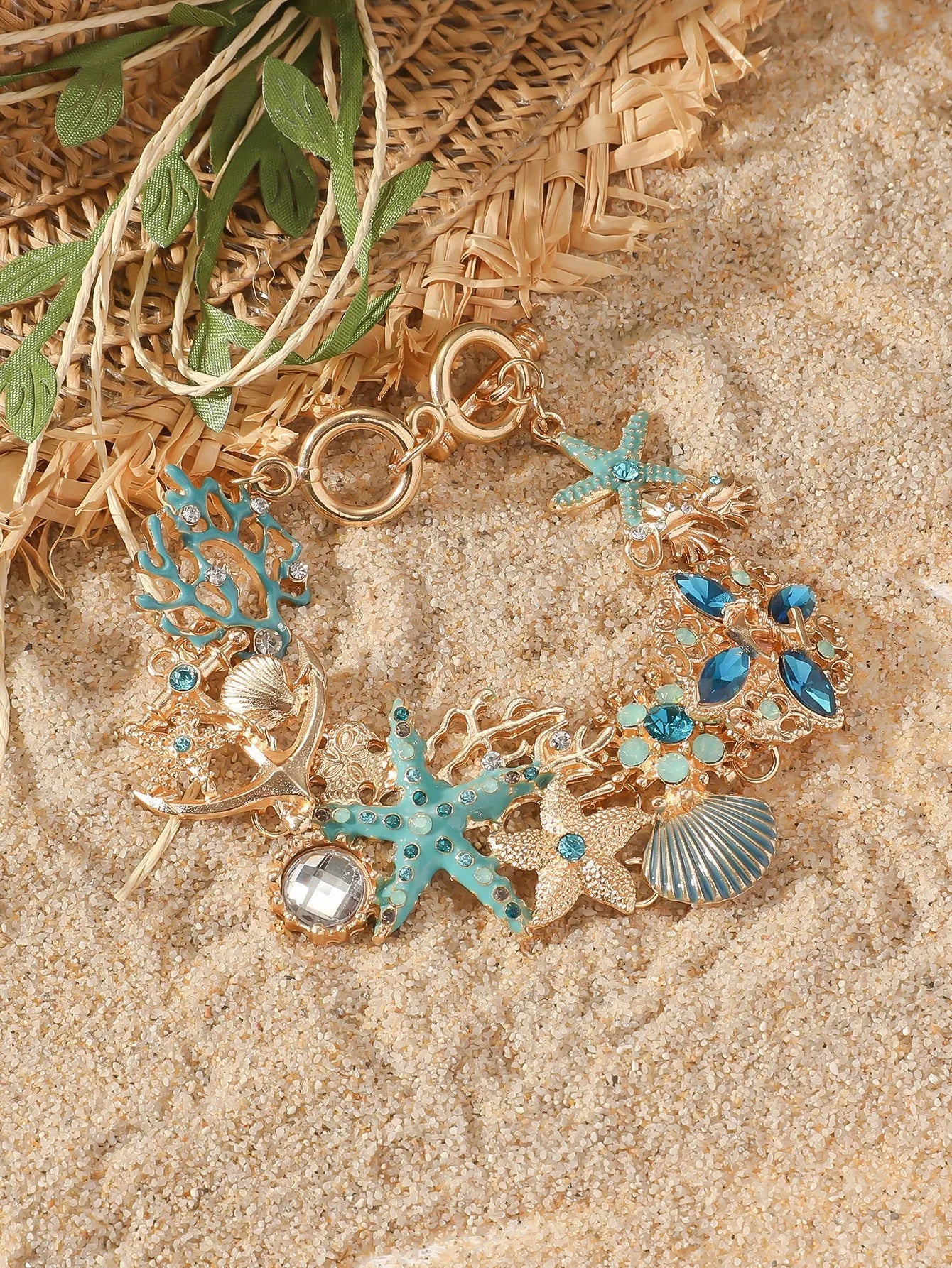 Women's alloy bracelet with starfish, star, and anchor design in turquoise, red, or blue colour.