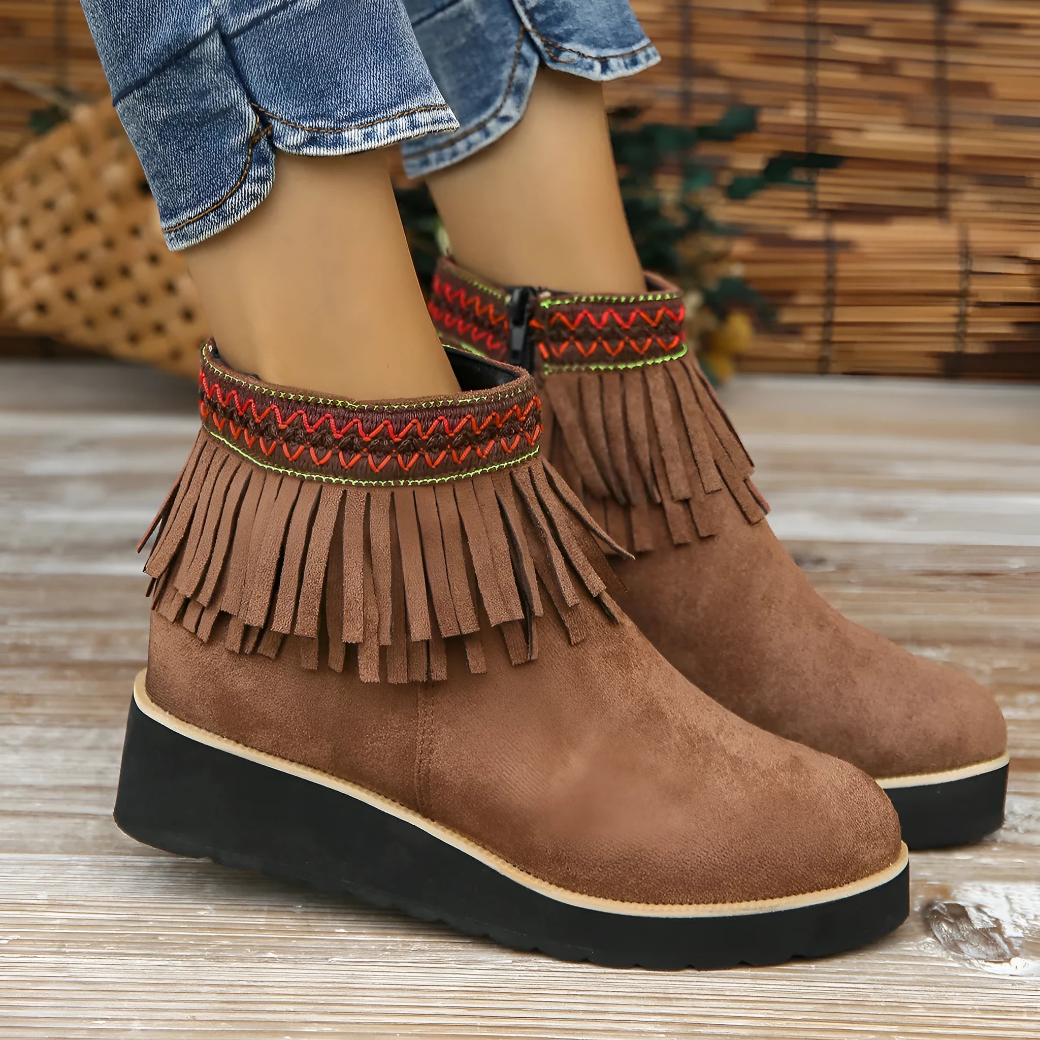 Women's suede wedge ankle boots in dark brown with a side zipper and thick rubber sole.
