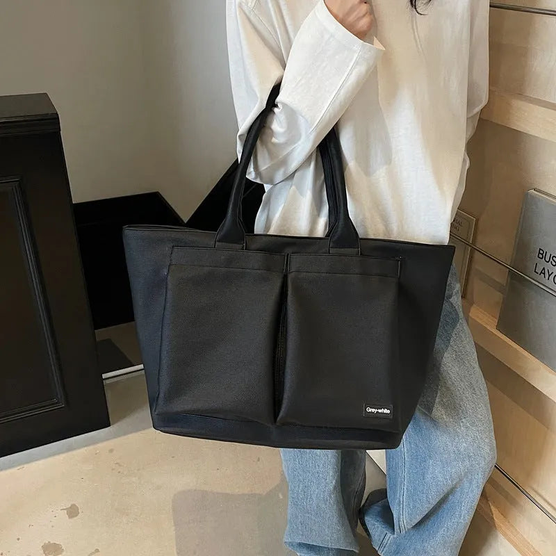 Lightweight PU shoulder bag in black, green, or white with 20-35 litre capacity
