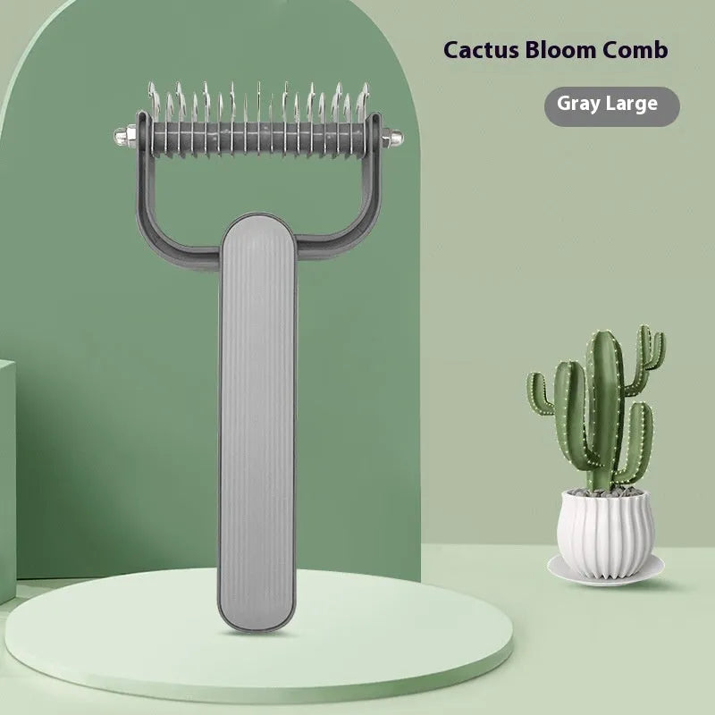 Green and grey dog detangling comb with stainless steel teeth on a PP plastic handle.