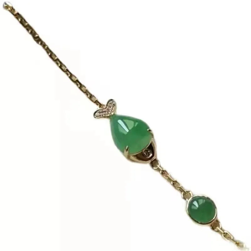 Yellow gold electroplated women's bracelet with retro style design on simple background