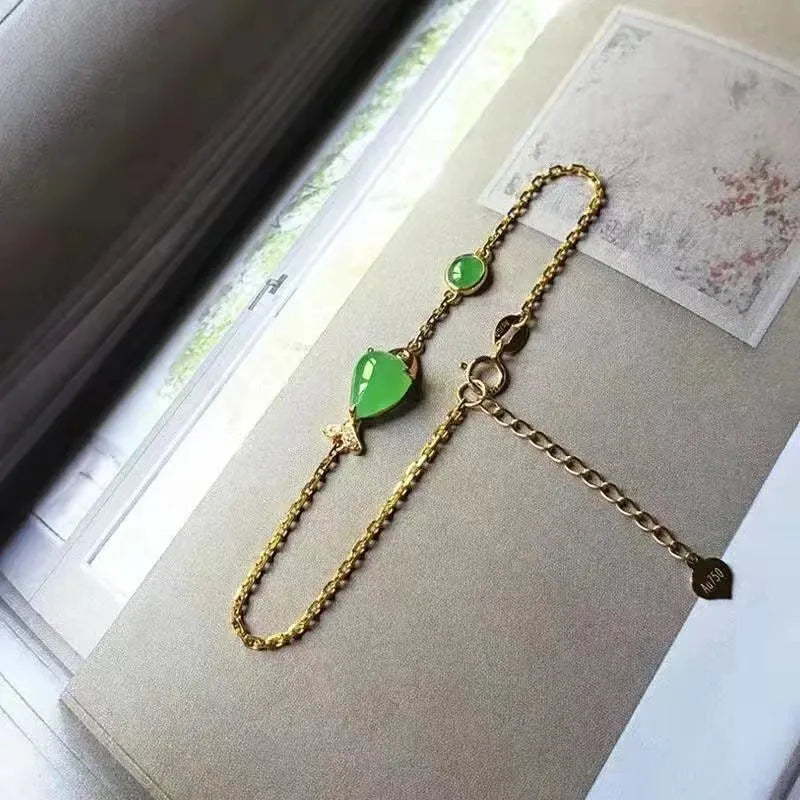 Yellow gold electroplated women's bracelet with retro style design on simple background