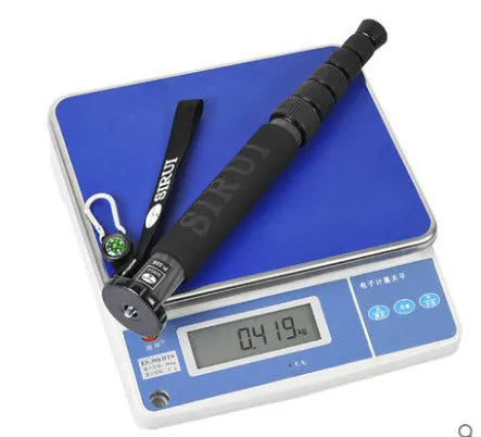 Black carbon fibre telescopic camera monopod extended to maximum height