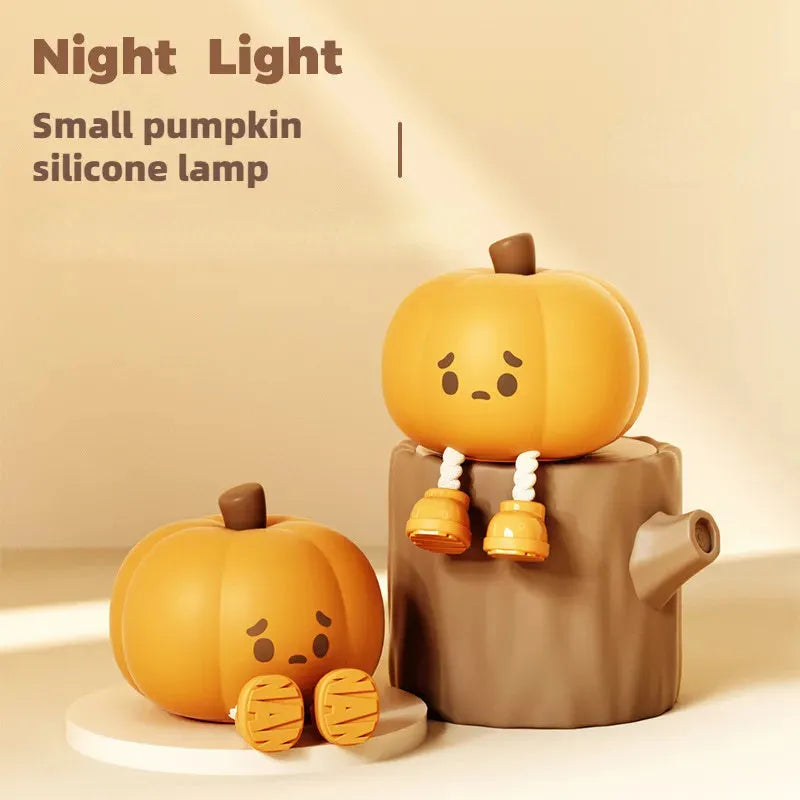 Soft orange silicone pumpkin-shaped night light with a warm glowing light.
