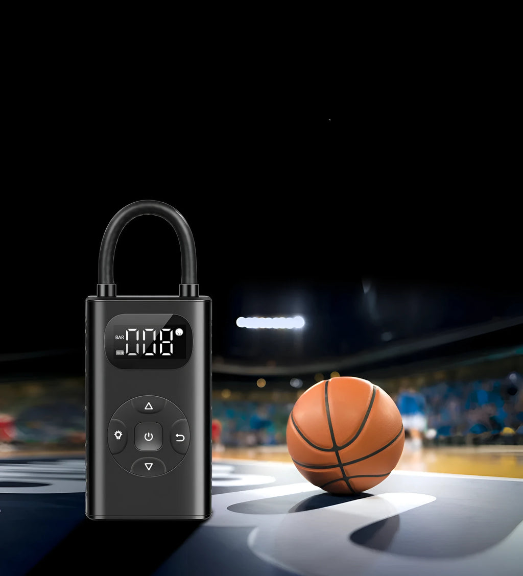 Black portable power bank tyre inflator with USB cable on a grey background.