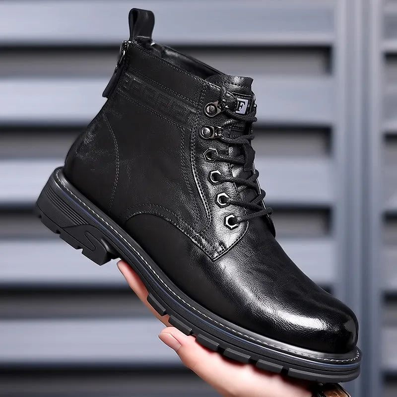 Black and brown leather Martin ankle boots with a rubber sole and visible stitching.