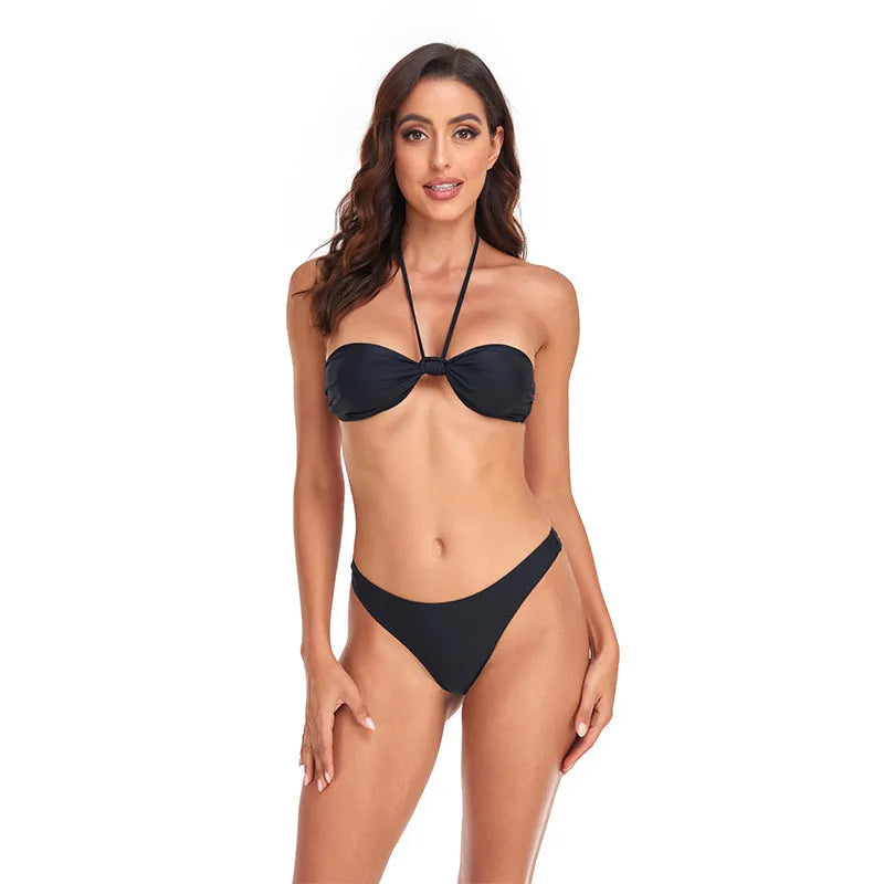 Black women's bikini set with lace-up tube top and split briefs on a plain background.