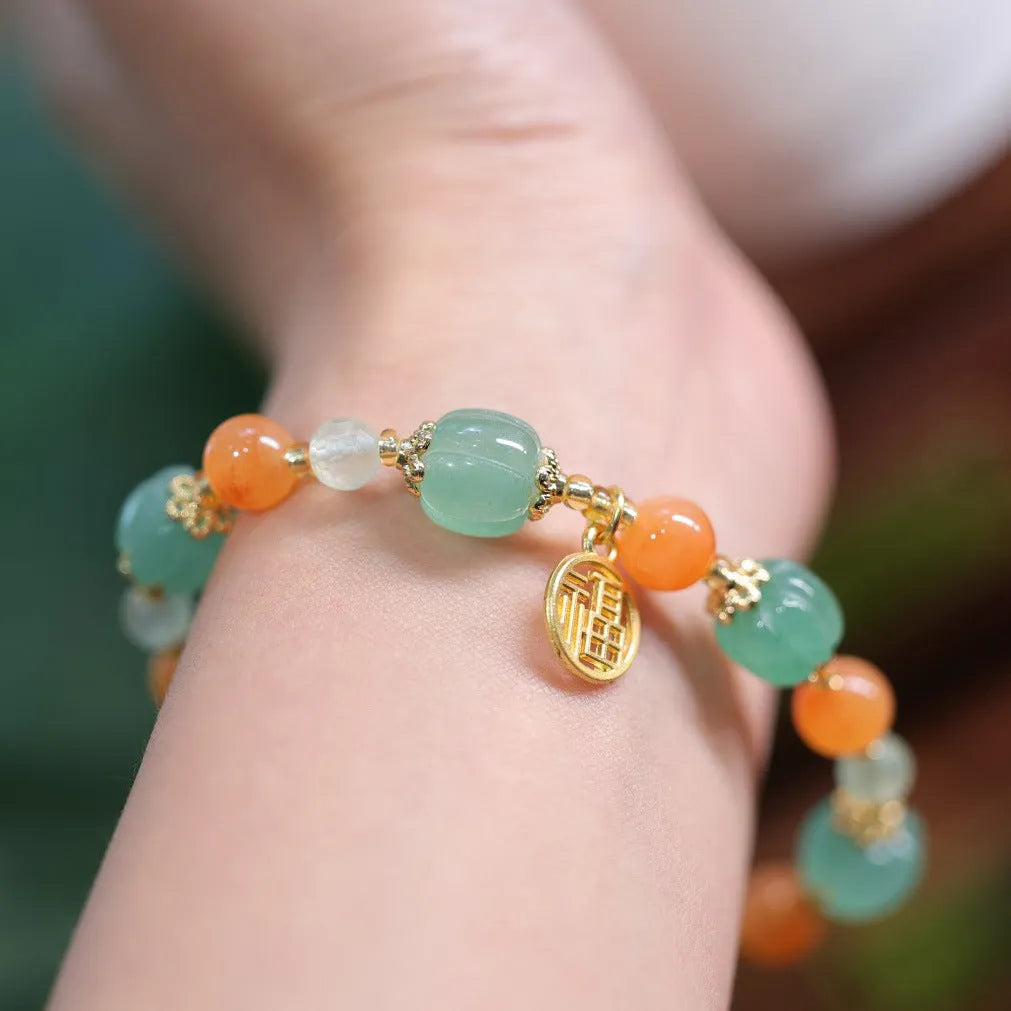 Traditional Chinese Duobao pumpkin bracelet with Jinsi Jade barrel beads and Fuka hanging charm