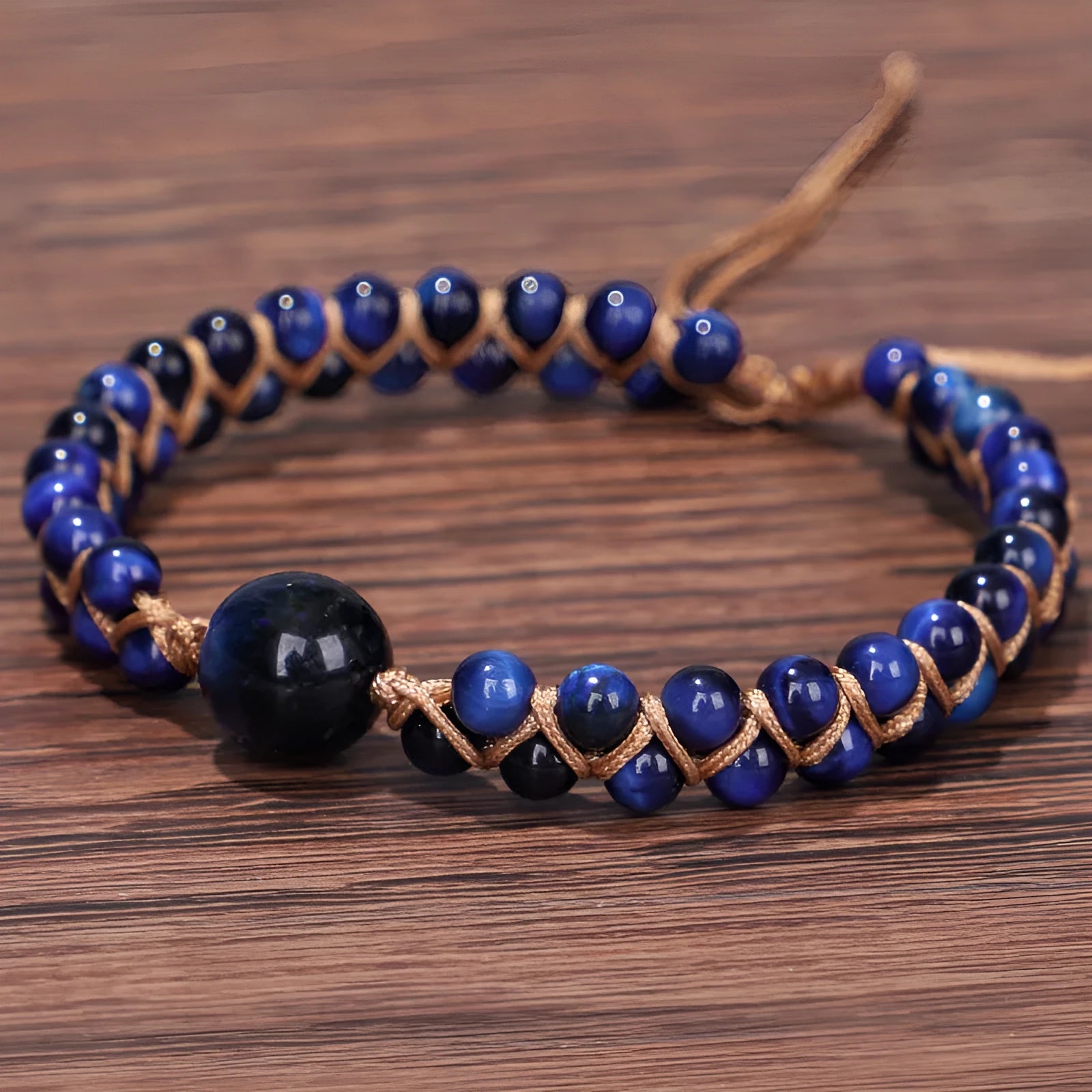 Handmade woven geometric pull bracelet with Tigereye and Amethyst beads in blue and purple colours